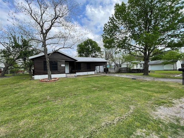 106 N 4th St, Celeste, TX 75423 - exterior space featuring a front yard, fence, and driveway