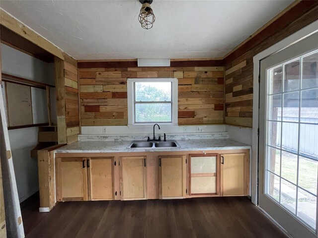 106 N 4th St, Celeste, TX 75423 - kitchen with a sink, light countertops, dark wood-style flooring, and wooden walls