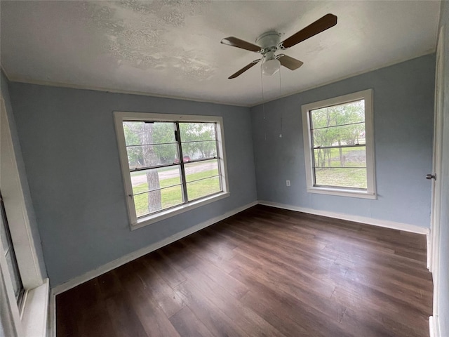 106 N 4th St, Celeste, TX 75423 - spare room featuring a wealth of natural light, dark wood-type flooring, and baseboards