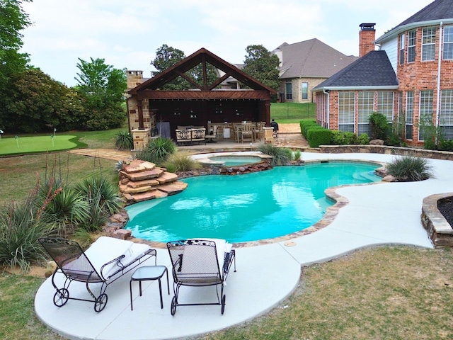 outdoor pool featuring a gazebo, a patio area, and an in ground hot tub