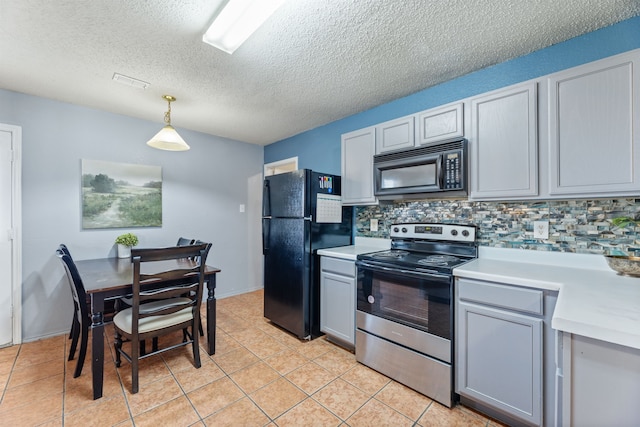kitchen featuring black appliances, light countertops, backsplash, gray cabinetry, and a textured ceiling