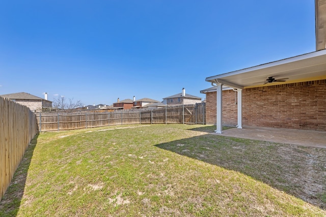 view of yard featuring ceiling fan and a patio area