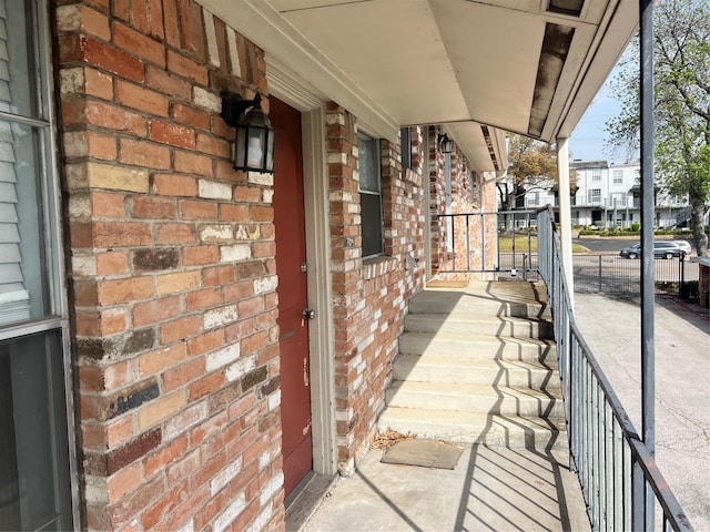 view of patio / terrace with a residential view and a porch