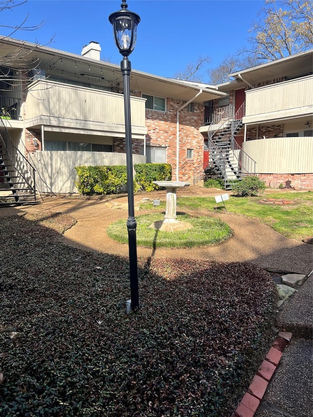 exterior space with fence and stairway