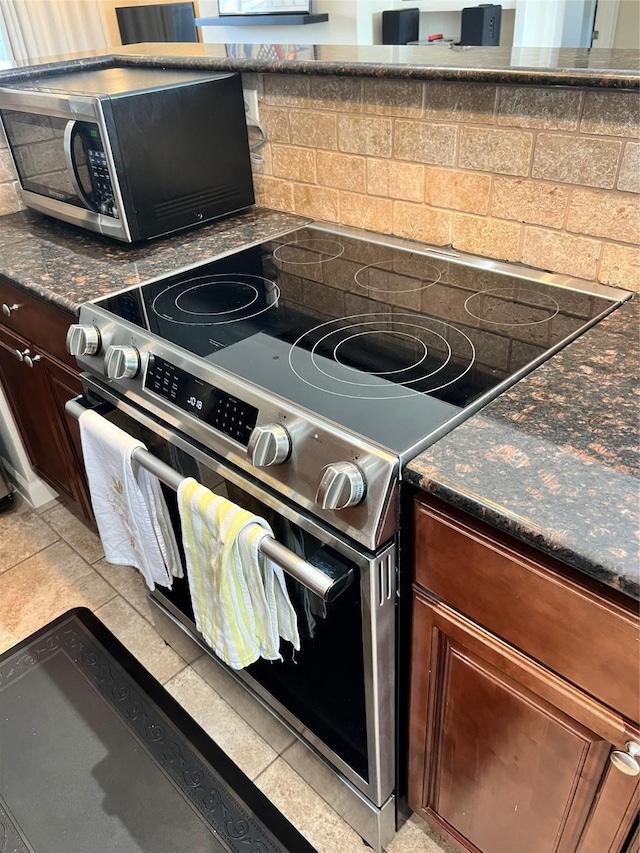kitchen featuring appliances with stainless steel finishes and decorative backsplash