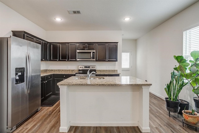 6214 Old Bridge Way, Forney, TX 75126 - kitchen with a sink, stainless steel appliances, wood finished floors, and visible vents