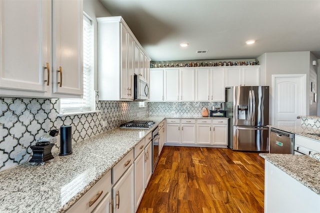 905 Bird Creek Dr, Little Elm, TX 75068 - kitchen with stainless steel appliances, white cabinetry, healthy amount of natural light, and recessed lighting