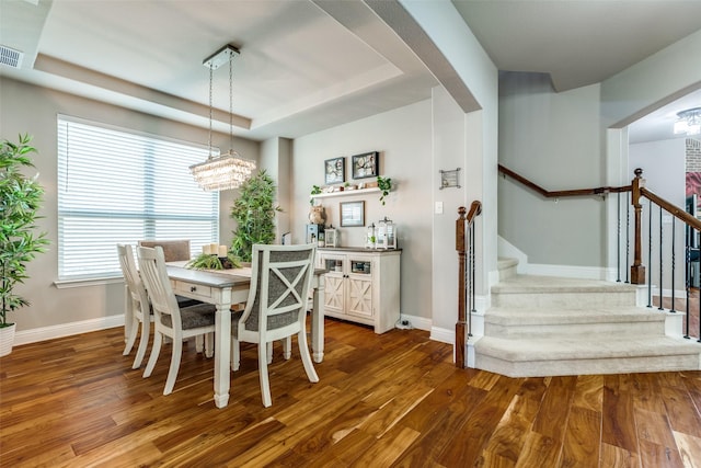 905 Bird Creek Dr, Little Elm, TX 75068 - dining space featuring stairway, baseboards, arched walkways, and wood finished floors