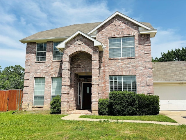 2212 Remmington Dr, Flower Mound, TX 75028 - view of front of house with brick siding, roof with shingles, and a garage