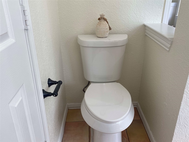 2212 Remmington Dr, Flower Mound, TX 75028 - bathroom with tile patterned flooring, toilet, and baseboards
