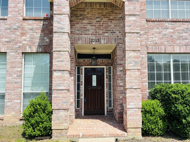 2212 Remmington Dr, Flower Mound, TX 75028 - property entrance featuring brick siding