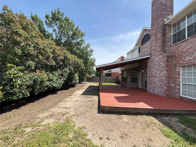 2212 Remmington Dr, Flower Mound, TX 75028 - view of yard with a wooden deck and fence