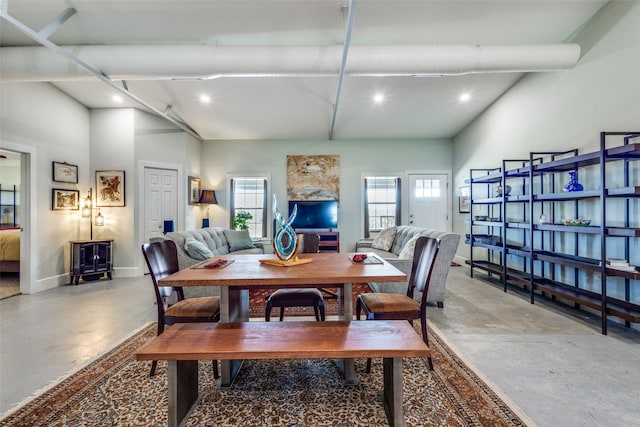 dining space featuring concrete floors, plenty of natural light, baseboards, and recessed lighting