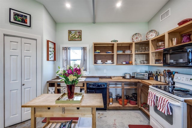 kitchen featuring visible vents, black appliances, and butcher block countertops