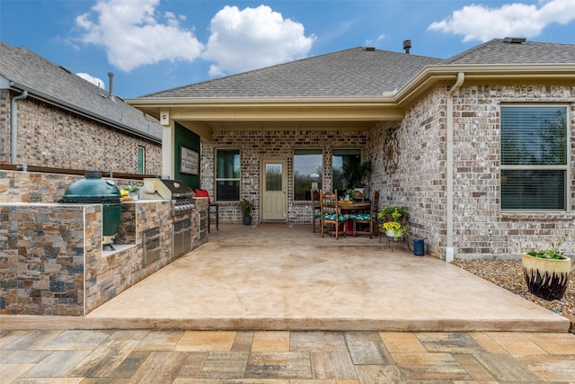 view of patio / terrace featuring area for grilling and outdoor dining area