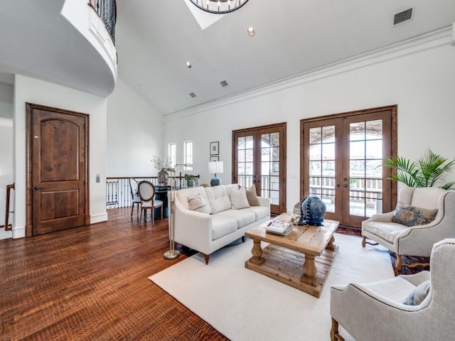 living room featuring visible vents, french doors, crown molding, and high vaulted ceiling