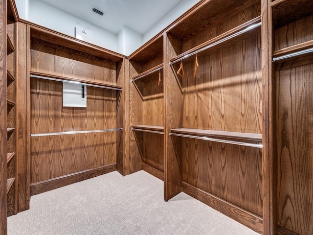 spacious closet with carpet and visible vents