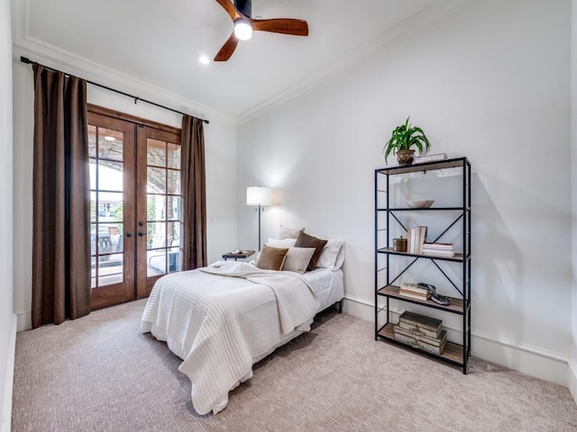bedroom with carpet, french doors, ornamental molding, and access to outside