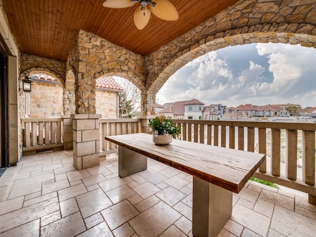 view of patio / terrace with a residential view, outdoor dining space, and ceiling fan