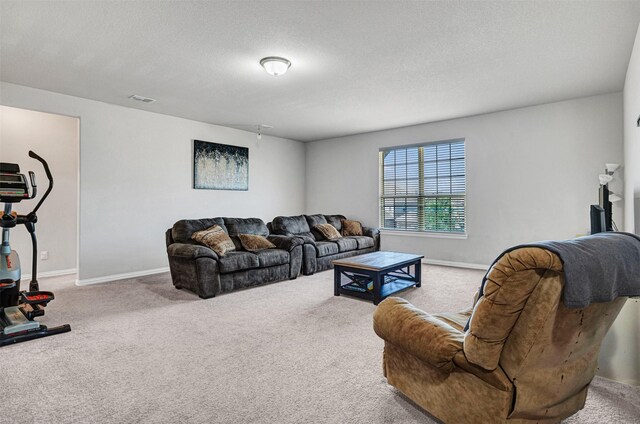 living area with baseboards and carpet floors