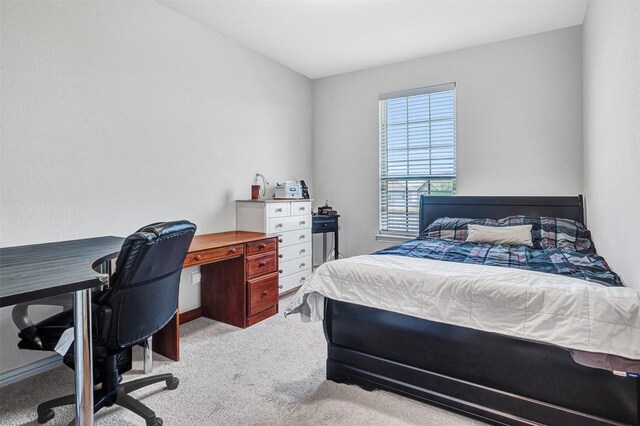 carpeted bedroom with baseboards