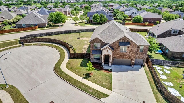 birds eye view of property with a residential view