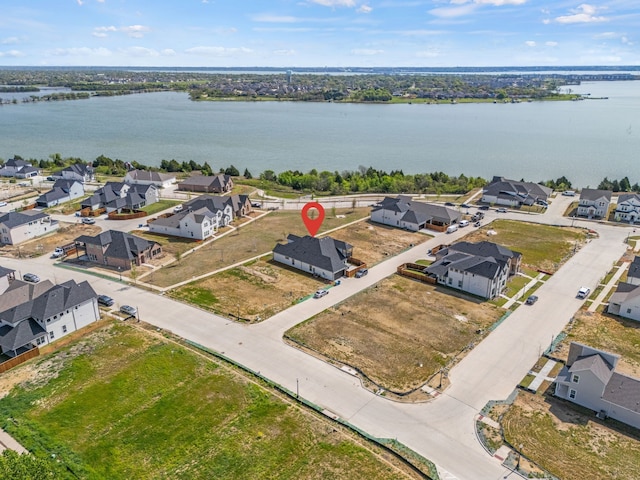 birds eye view of property featuring a residential view and a water view