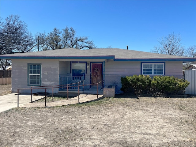 ranch-style house with fence and a porch