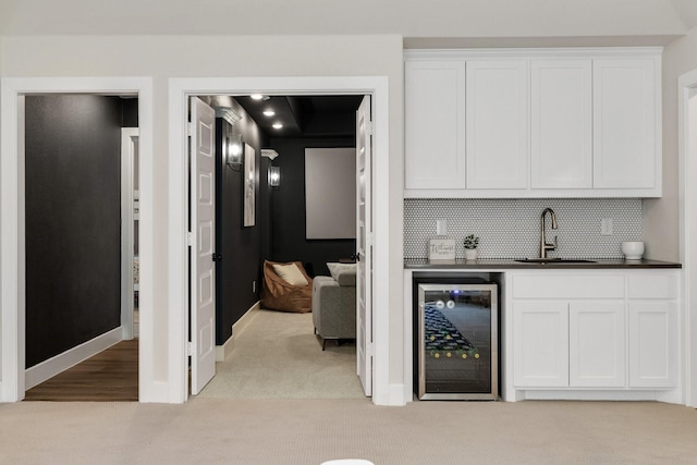 1030 Lone Grove Ln, Prosper, TX 75078 - bar with light carpet, beverage cooler, baseboards, indoor wet bar, and a sink