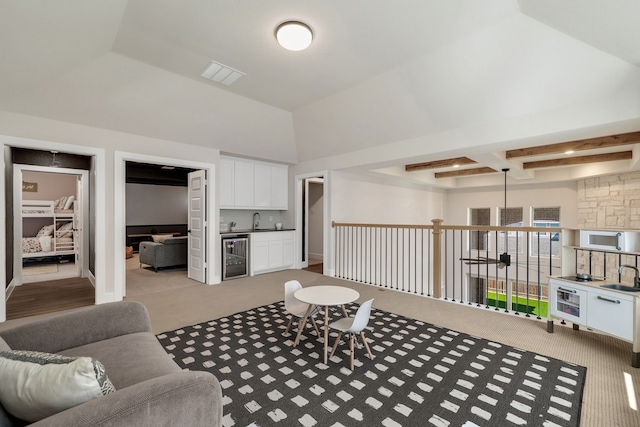 1030 Lone Grove Ln, Prosper, TX 75078 - carpeted living room with indoor wet bar, visible vents, a sink, and wine cooler