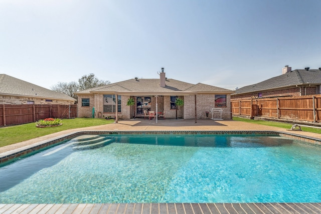 view of pool with a fenced in pool, a patio area, a fenced backyard, and a lawn