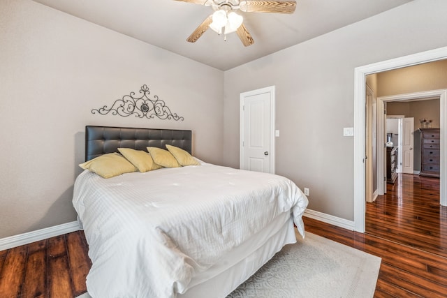 bedroom featuring wood finished floors, baseboards, and a ceiling fan