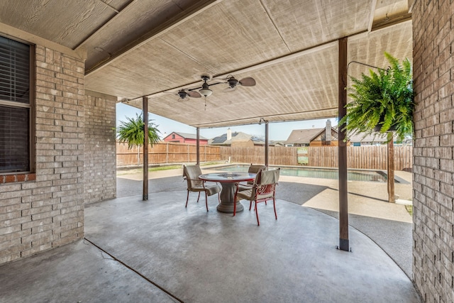 view of patio with a fenced backyard and ceiling fan