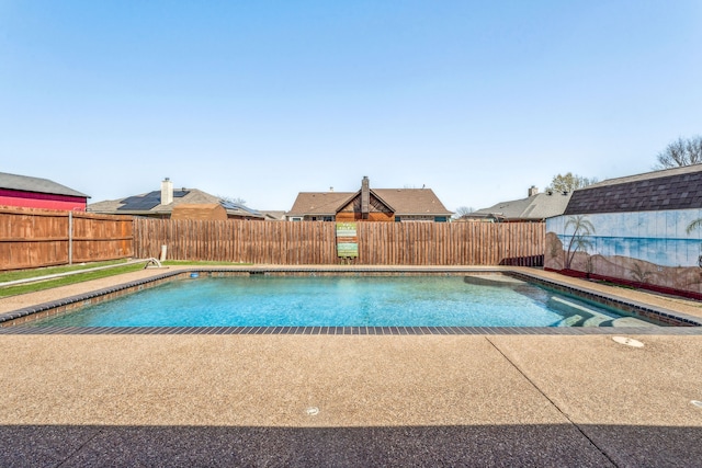view of swimming pool featuring a patio area, a fenced backyard, and a fenced in pool