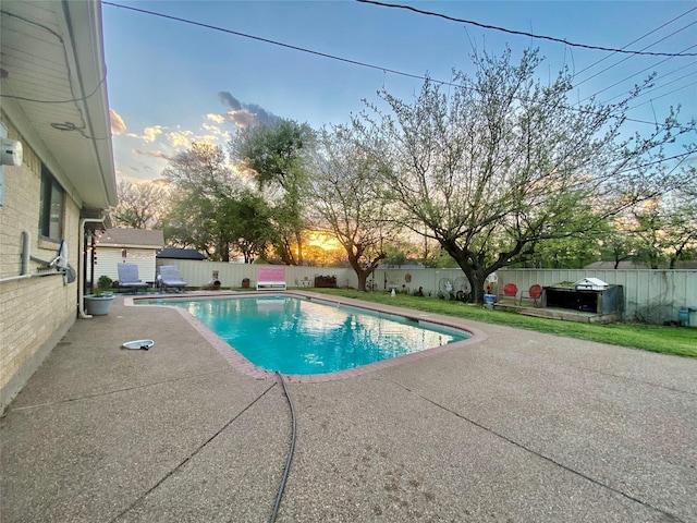 view of pool featuring a patio area, a fenced backyard, and a fenced in pool