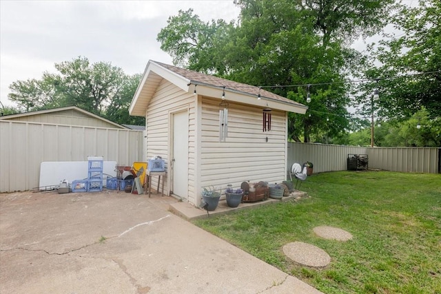 view of shed with a fenced backyard