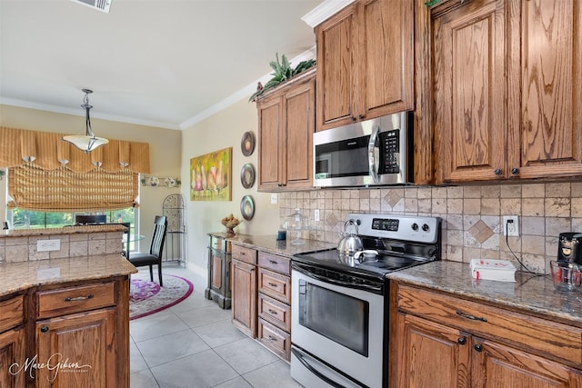 kitchen featuring ornamental molding, brown cabinets, backsplash, and stainless steel appliances