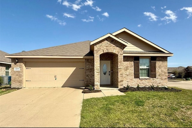 2077 Enchanted Rock Dr, Forney, TX 75126 - single story home featuring driveway, an attached garage, a front lawn, central AC unit, and brick siding