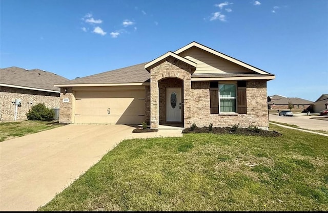 view of front of home featuring an attached garage, driveway, a front yard, and brick siding