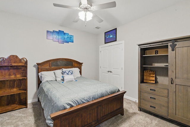 bedroom featuring a ceiling fan, light carpet, baseboards, and visible vents