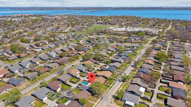 birds eye view of property featuring a water view and a residential view