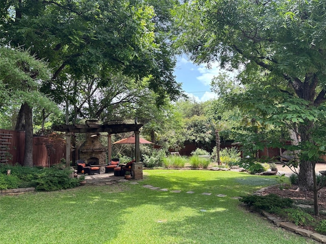 6814 Blackwood Dr, Dallas, TX 75231 - view of yard with an outdoor living space with a fireplace