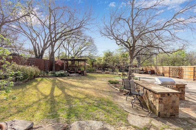 6814 Blackwood Dr, Dallas, TX 75231 - view of yard featuring a pergola and exterior kitchen