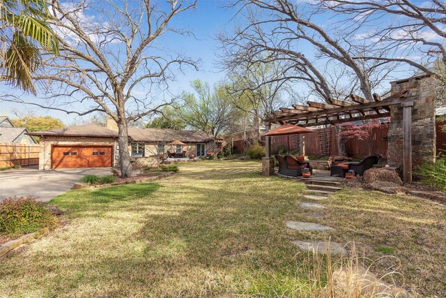 6814 Blackwood Dr, Dallas, TX 75231 - view of yard with a pergola, driveway, and a garage