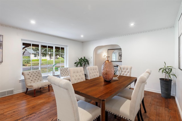 6814 Blackwood Dr, Dallas, TX 75231 - dining room featuring arched walkways, baseboards, wood finished floors, and recessed lighting
