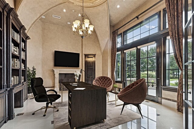 office space with a fireplace, a high ceiling, a notable chandelier, and recessed lighting