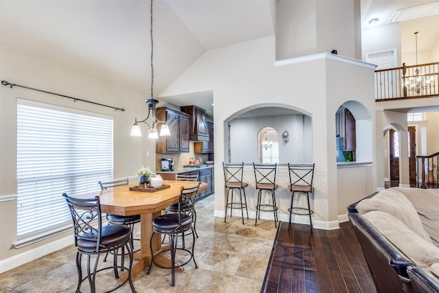 3533 Hutch Dr, Plano, TX 75074 - dining area with arched walkways, high vaulted ceiling, and a wealth of natural light