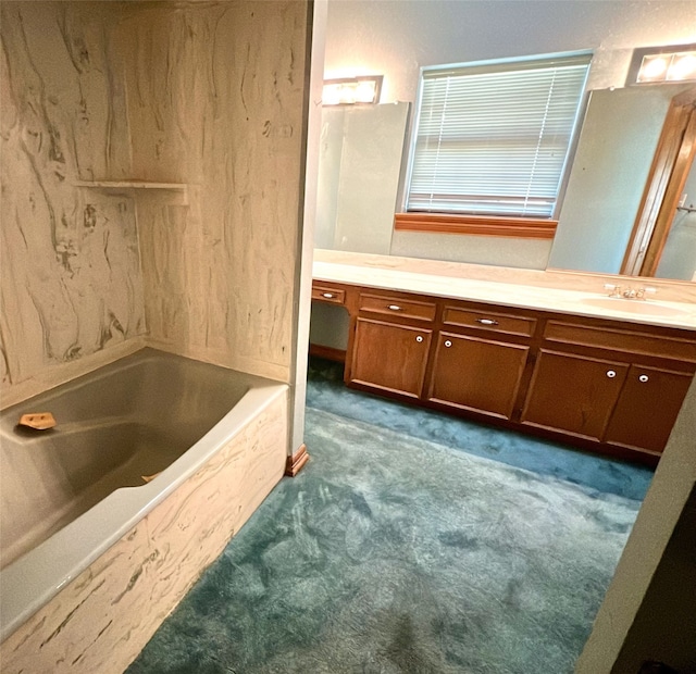 bathroom with a bathing tub and vanity