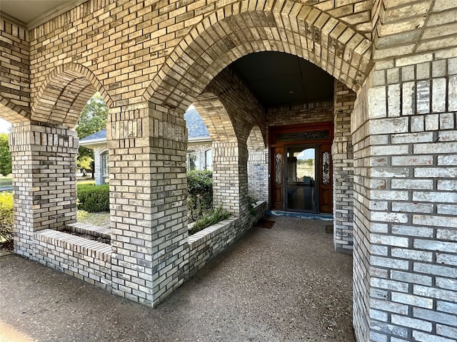 property entrance with brick siding