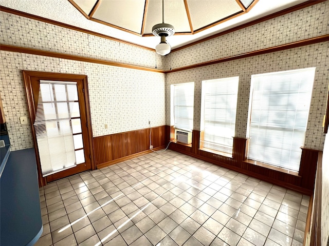 unfurnished sunroom with cooling unit and a skylight